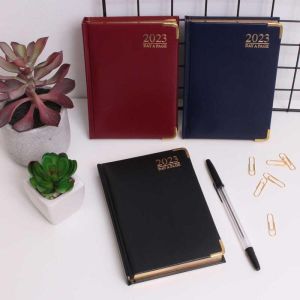  2023 A6 Day a Page Diary Padded Hardback Gilt Edge With Metal Corners(Random)